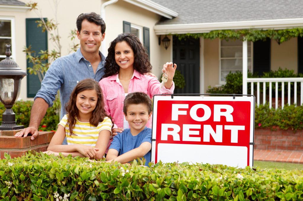 family with home for rent sign