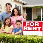 family with home for rent sign