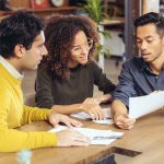 Couple on meeting with real estate advisor